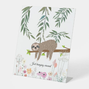 Adorable hand drawn sloth hanging around sign