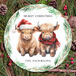 Adorable Highland Cow Calf Farm Merry Christmas  Classic Round Sticker<br><div class="desc">This Christmas, send your warmest wishes to your loved ones with our adorable Highland Cow Christmas cards! Featuring a cute trio of a Highland calves, all decked out in festive attire, these cards are sure to bring a smile to anyone's face. Cow wearing a Santa hat and plaid winter scarf,...</div>