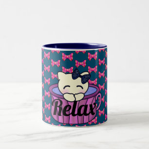 Adorable Kitty Cat Relaxing in Pretty Pink Tea Cup