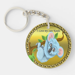 Adorable koala bear hanging on a tree branch keychain