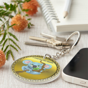 Adorable koala bear in a tree in the forest keychain