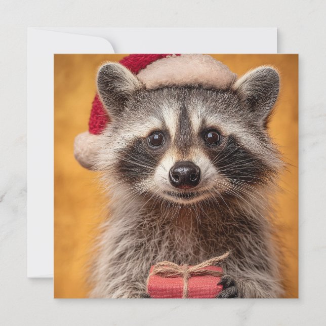 Adorable Raccoon in a Santa Hat Holding a Present Holiday Card (Front)