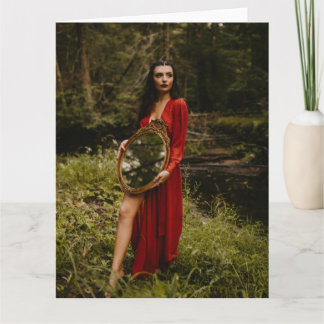 Adorable women standing with mirror card