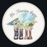 Adventure Begins Hiking Boots Classic Round Sticker<br><div class="desc">This chic "The Adventure Begins" couples/wedding/bridal shower/engagement sticker features two pairs of hiking boots/trekking shoes with flowers in front of a mountain range in watercolor. Personalize it for your needs. You can find matching products at my store.</div>