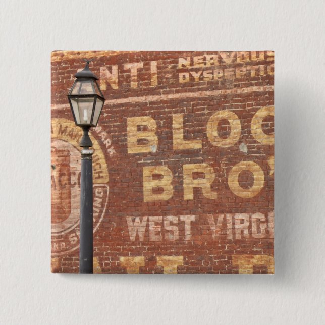 Advertisements on side of building 2 inch square button (Front)