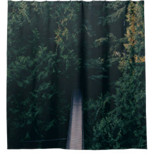AERIAL PHOTOGRAPHY OF HANGING BRIDGE NEAR TREES