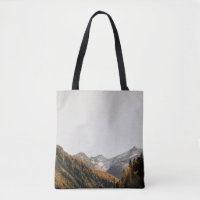 AERIAL PHOTOGRAPHY OF MOUNTAIN UNDER CLOUDY SKY
