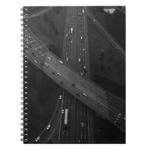 AERIAL PHOTOGRAPHY OF VEHICLE ON ROAD NOTEBOOK