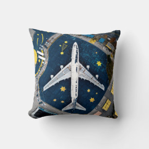 AERIAL PHOTOGRAPHY OF WHITE AND BLACK AIR LINER ON THROW PILLOW