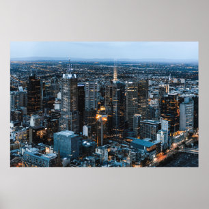 AERIAL VIEW OF CITY BUILDINGS DURING NIGHT TIME POSTER