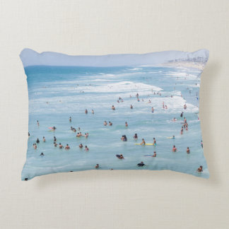 AERIAL VIEW OF GROUP OF PEOPLE SWIMMING ON BEACH ACCENT PILLOW