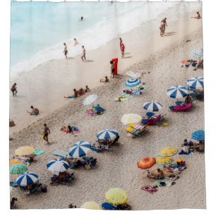 AERIAL VIEW OF PARASOLS AND PEOPLE NEAR BEACH