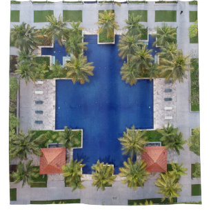 Aerial view of pool surrounded by palm trees