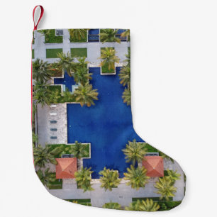 Aerial view of pool surrounded by palm trees small christmas stocking