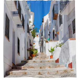 Aerial view of white city Frigiliana in sunny day 