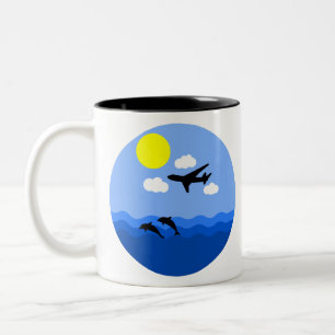 aeroplane flying over water with dolphins Two-Tone coffee mug