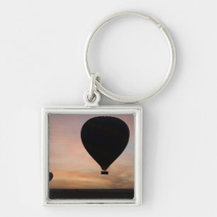 Africa, Kenya, Masai Mara. Two balloons glide Keychain