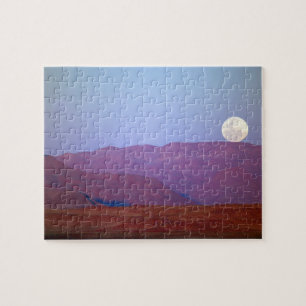 Africa, Namibia, Sossusvlei. A full moon rests Jigsaw Puzzle