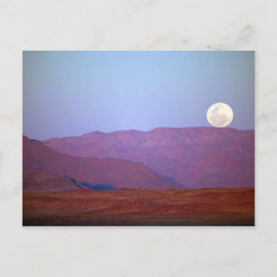 Africa, Namibia, Sossusvlei. A full moon rests Postcard