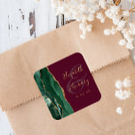 Agate Emerald Green Gold Script Burgundy Wedding Square Sticker<br><div class="desc">This elegant modern wedding sticker features an emerald green watercolor agate geode design trimmed with faux gold glitter. Easily customize the gold-coloured text on a burgundy background,  with the names of the bride and groom in whimsical handwriting calligraphy over a large ampersand.</div>