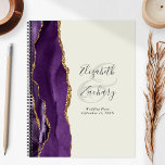 Agate Geode Purple Gold Ivory Wedding Plans Planner<br><div class="desc">This elegant modern wedding planner features a purple watercolor design trimmed with faux gold glitter. Easily customize the charcoal grey text on an ivory background, with the names of the bride and groom in handwriting calligraphy over a large ampersand. Add the title and wedding date below in italics. The back...</div>