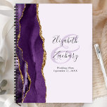 Agate Geode Purple Gold Lavender Wedding Plans Planner<br><div class="desc">This elegant modern wedding planner features a purple watercolor design trimmed with faux gold glitter. Easily customize the charcoal grey text on a pale lavender background, with the names of the bride and groom in handwriting calligraphy over a large ampersand. Add the title and wedding date below in italics. The...</div>