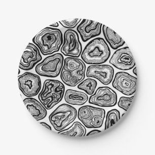 Agate slices in black and white paper plate
