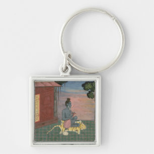 Aged ascetic seated on a tiger skin outside a buil keychain