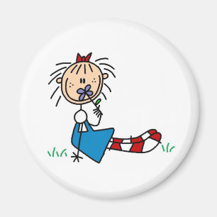 Aimant Annie se situant dans l'herbe avec l'aimant de