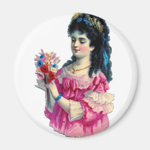 Aimant Brune victorienne dans la robe rose avec le
