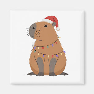 Aimant Capybara de Noël avec chapeau de Père Noël et lumi