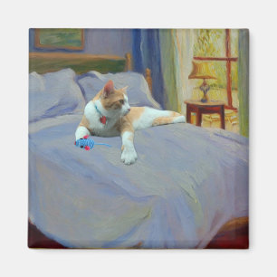 Aimant Chat orange sur le lit