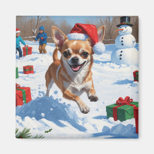 Aimant Chihuahua courant dans la neige avec un chapeau de