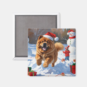 Aimant Chow Chow courant dans la neige avec un chapeau de