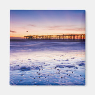 Aimant Coucher de soleil sur la jetée et la plage de Vent
