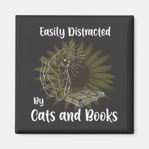 Aimant Facilement distrait par les chats et les livres