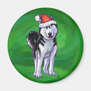 Aimant Husky festif à Santa Hat sur Vert