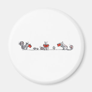 Aimant Le cru mignon accumule des livres de lecture