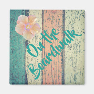 Aimant Maison de plage en bois peint côté océan rayé