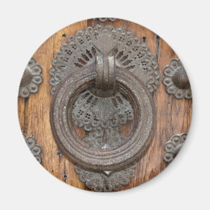 Aimant Metal Knocker on Old Wooden Door
