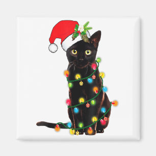 Aimant Père Noël chat noir empêtré dans les lumières de N