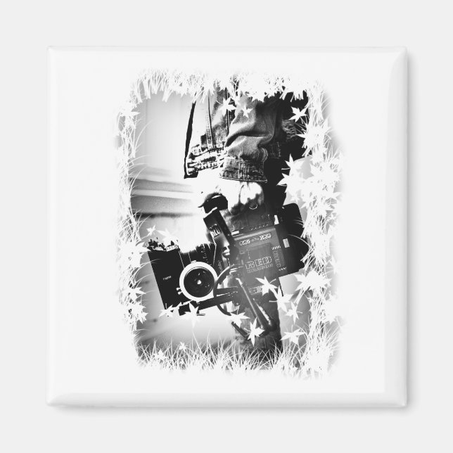 Aimant Pessoa Segurando uma câmera dslr Preta (Devant)