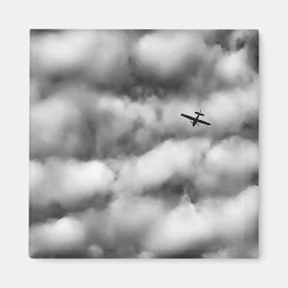 Aimant Small Airplane Flying in Cloudy Sky Photo
