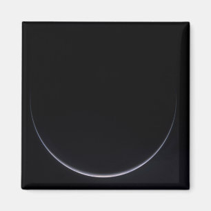 Aimant Un croissant soleil-illuminé de la terre