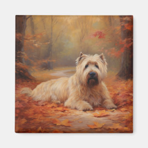 Aimant Wheaten Terrier dans les feuilles d'automne automn