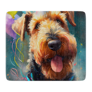 Airedale dog with birthday hat and balloons cutting board
