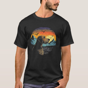 Airedale Terrier Dog and Sun Rising Over Mountains T-Shirt