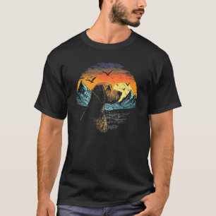 Airedale Terrier Dog and Sun Rising Over Mountains T-Shirt