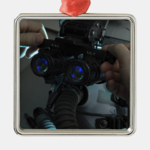 Airman adjusts the eyespan metal ornament