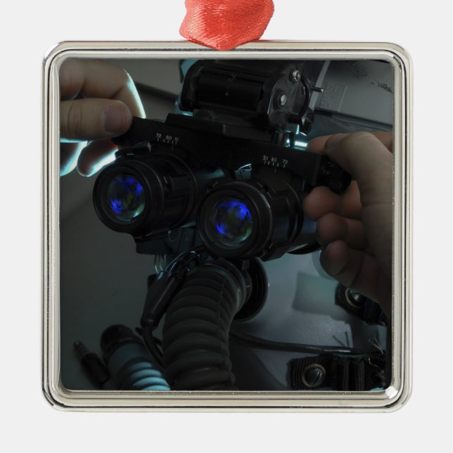 Airman adjusts the eyespan metal ornament (Front)